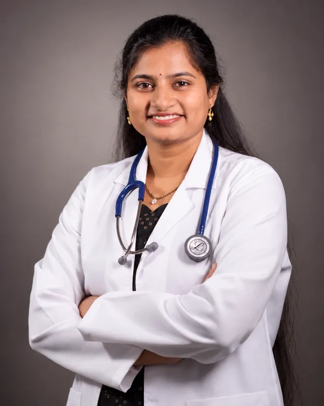 Portrait of Dr. Tejaswini Tumma in a white coat